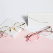 gold framed eyeglasses on white paper