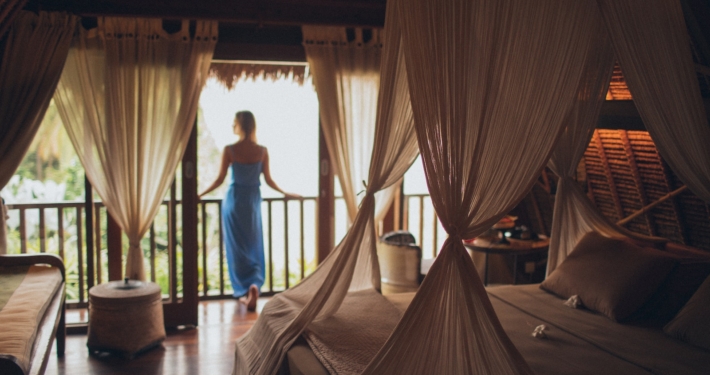 Woman Leaning on Handrail in Room