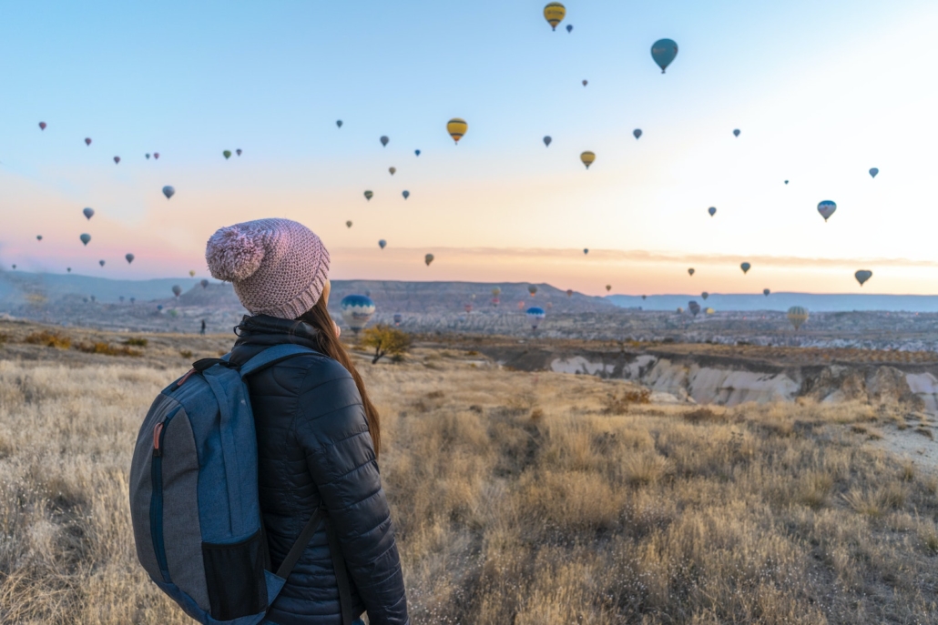 Woman Looking At Hot Air Balloons