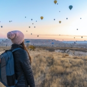 Woman Looking At Hot Air Balloons