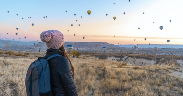 Woman Looking At Hot Air Balloons