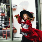 Woman in Red Coat Holding Book