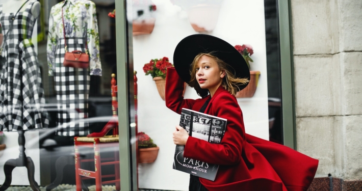 Woman in Red Coat Holding Book