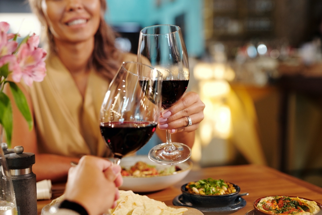 Couple in a Restaurant Drinking Red Wine