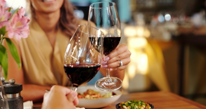 Couple in a Restaurant Drinking Red Wine