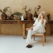 A Happy Elderly Woman Sitting in a Chair