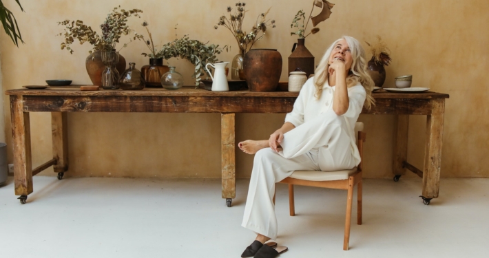 A Happy Elderly Woman Sitting in a Chair