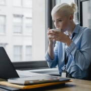 Female manager drinking coffee at workplace