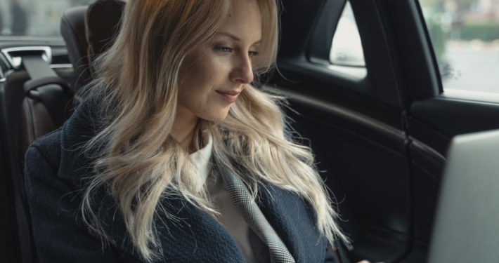 Beautiful Woman in Blue Coat Sitting in the Car