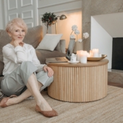 Woman in White Dress Shirt Sitting on the Floor