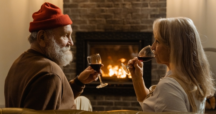 Man and Woman Holding Wine Glasses