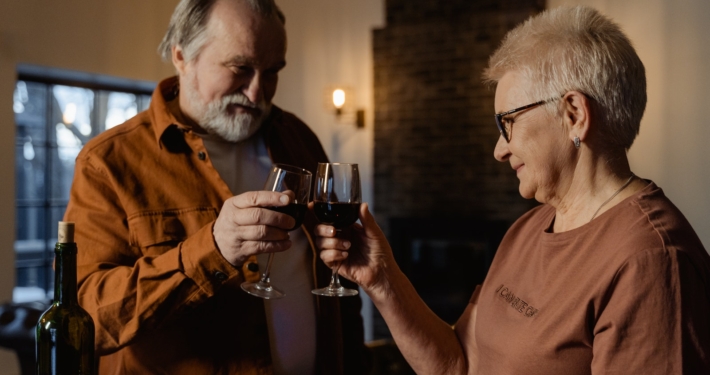 Man in Brown Button Up Shirt Holding a Wine Glass