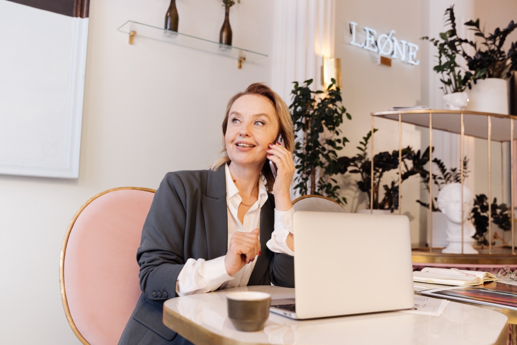 Woman Talking on Phone at Work