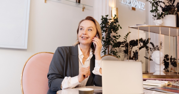 Woman Talking on Phone at Work