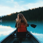 blonde haired woman riding on boat