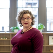 woman wearing red framed eyeglasses