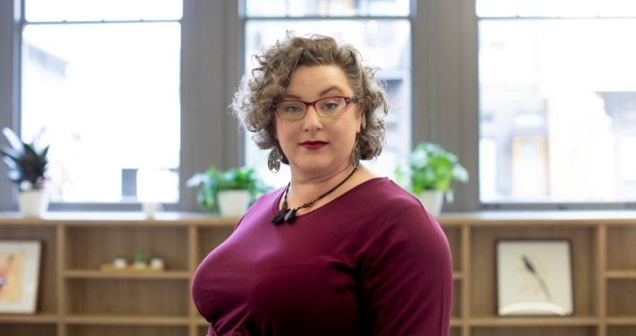 woman wearing red framed eyeglasses