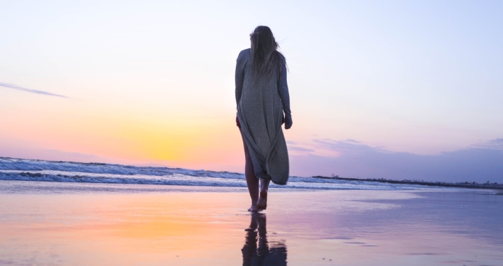 woman standing on beachfront