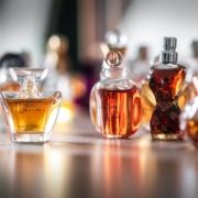 selective focus photography of clear glass perfume bottle