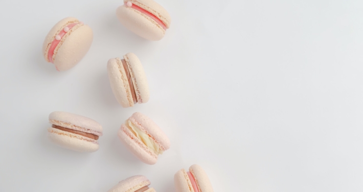 a group of macaroons sitting on top of a white table