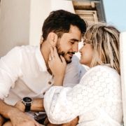 smiling man and woman about to kiss