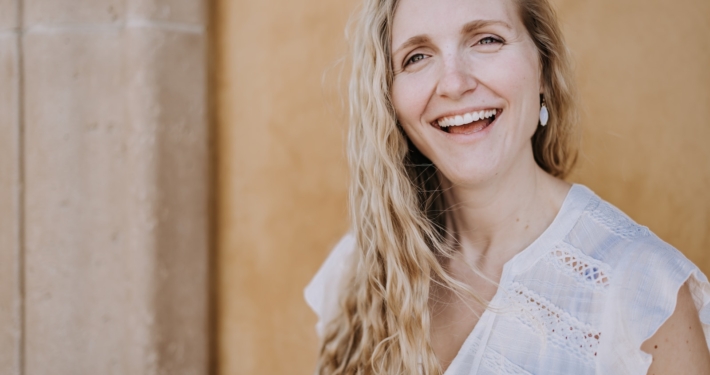 smiling woman in white lace shirt