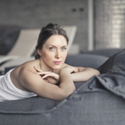 Woman Covered in Towel Lying on Bed