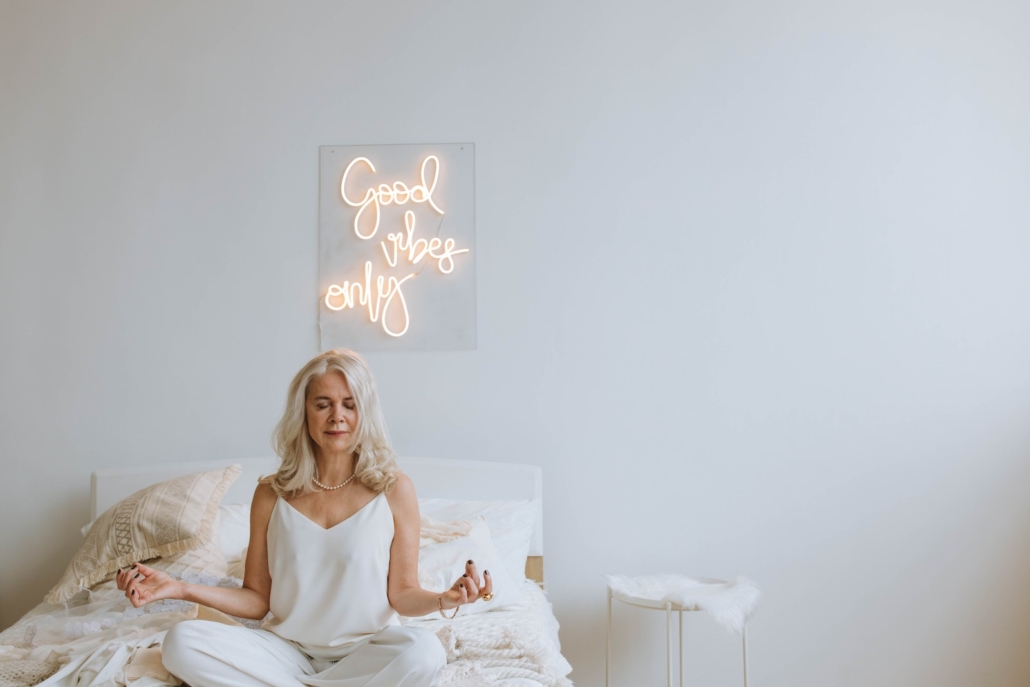 Photo of a Woman with Gray Hair Meditating