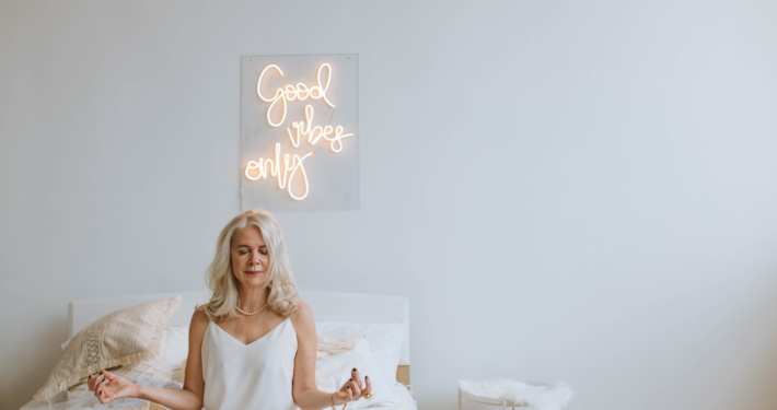 Photo of a Woman with Gray Hair Meditating