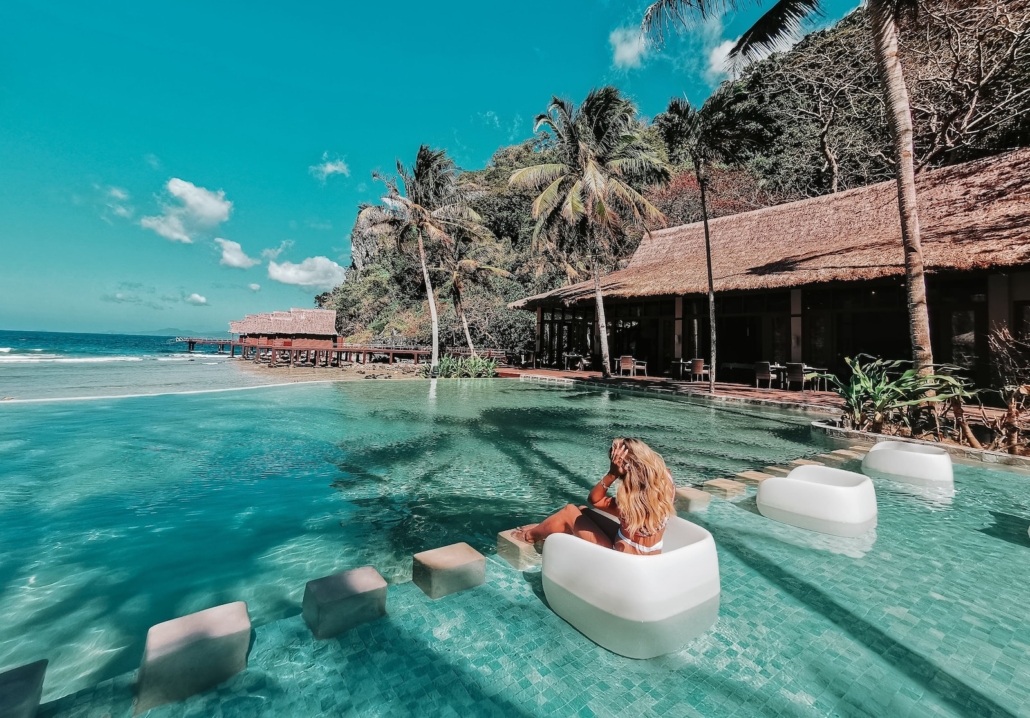 woman in swimming pool during daytime