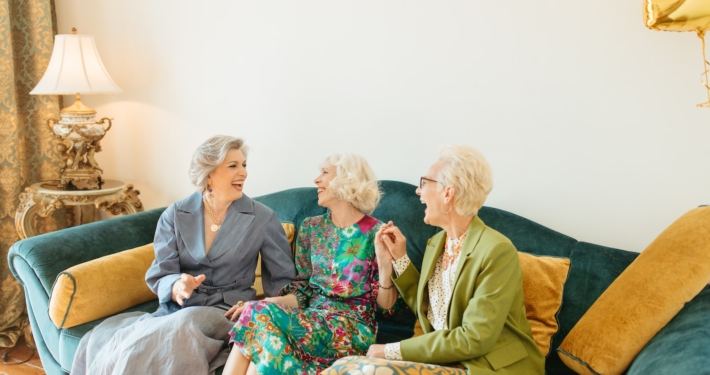 Laughing Elderly Women Sitting on Couch