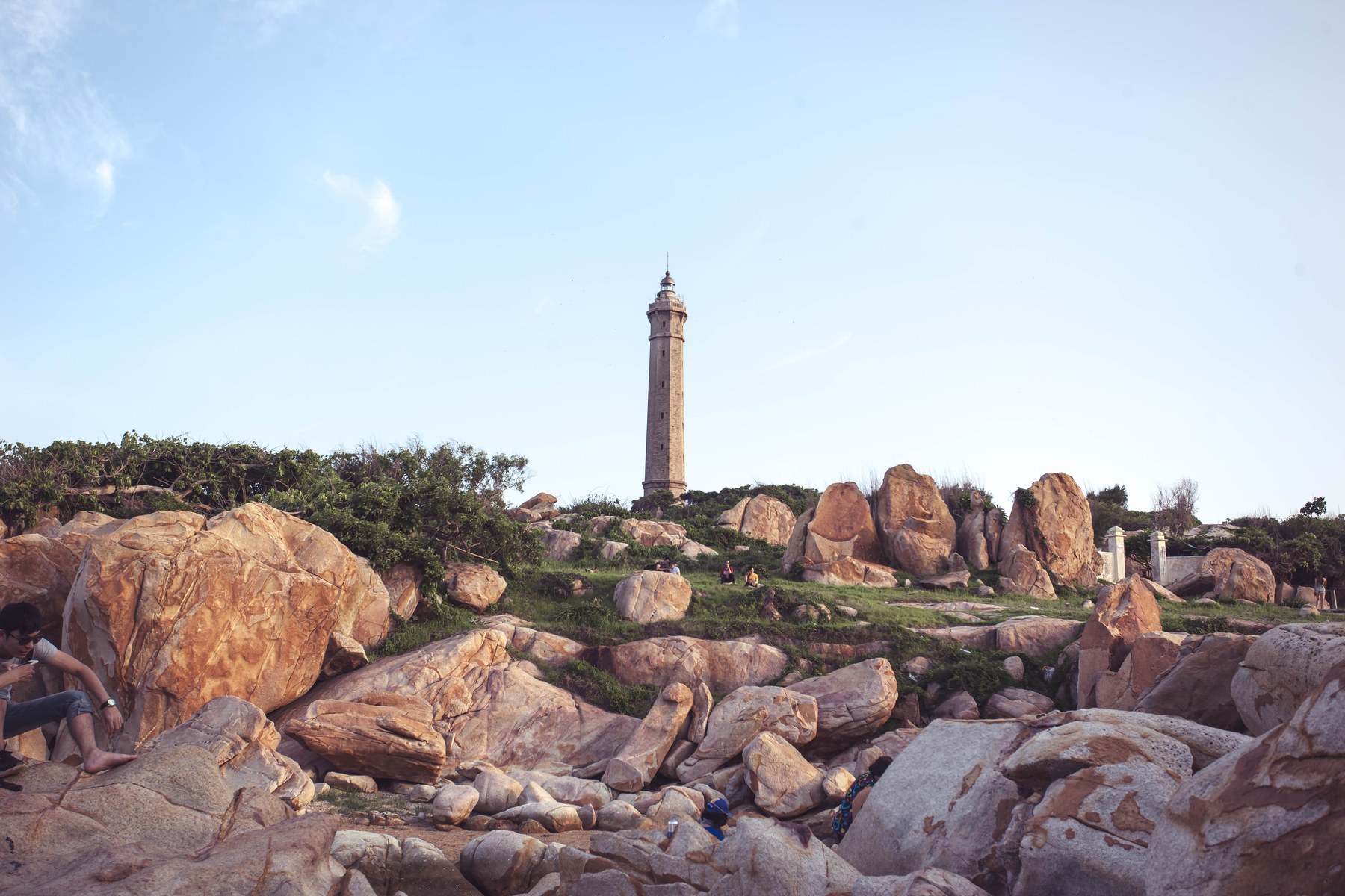 The Ke Ga lighthouse rises above granite boulders on its islet off Ke Ga Bay.