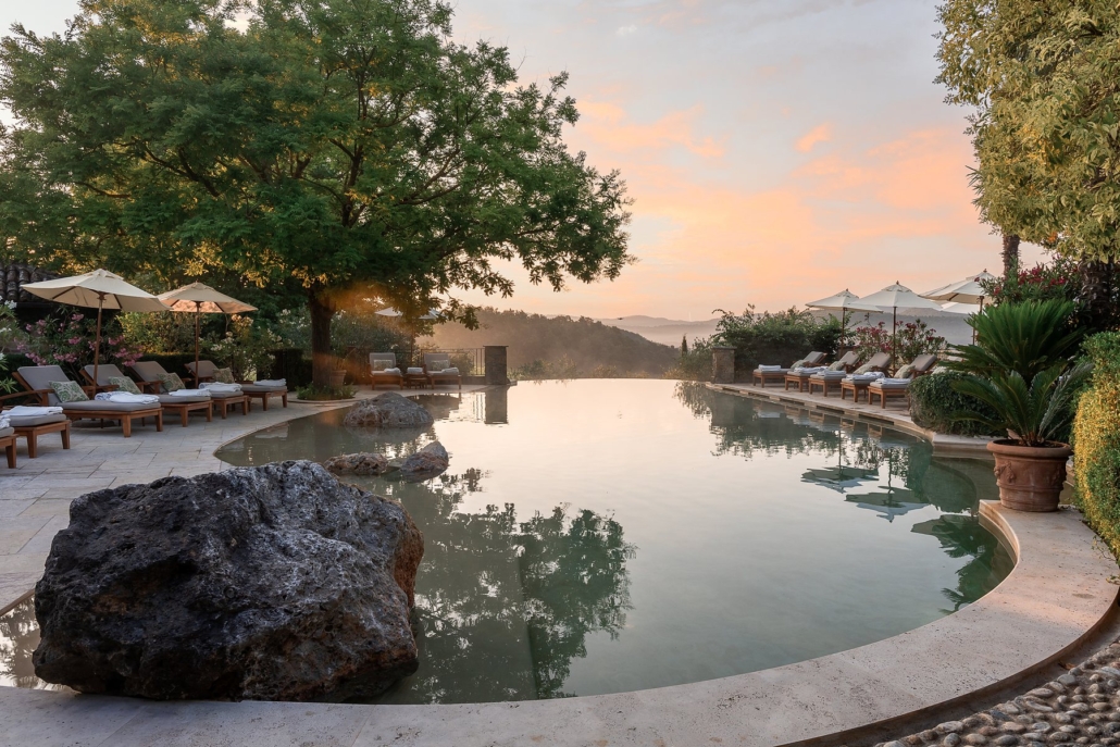 The freshwater infinity pool at Borgo Santo Pietro at sunset.