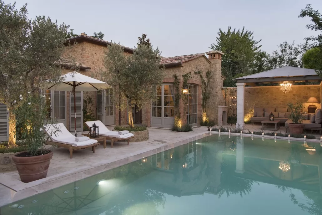 Casa dei Fiori Bianchi, one of the private-pool suites, lit at dusk.