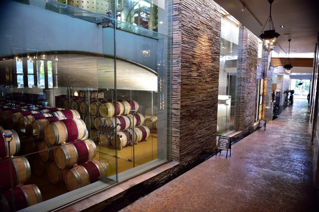Glass-walled winery corridor at Delaire Graff Estate.