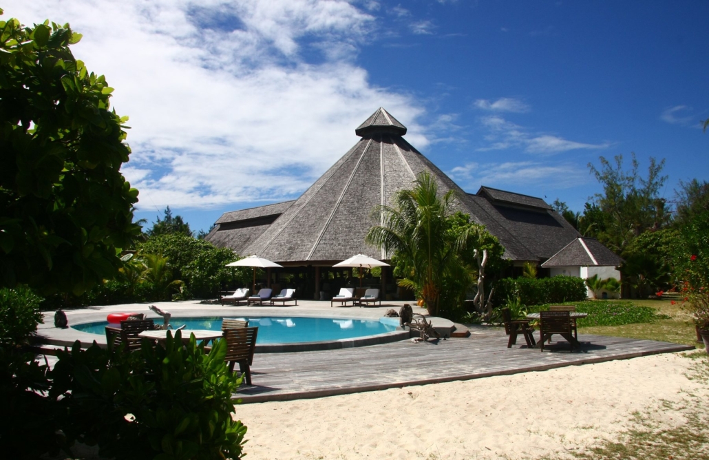 Thatched resort centre and pool deck at Denis Private Island.