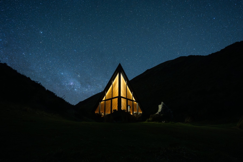 A mirrored Pod at The Lindis under a star-filled Ahuriri sky.