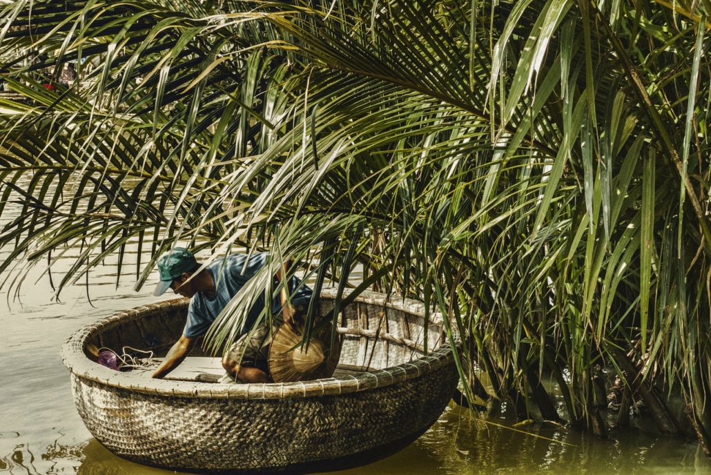 A round basket boat among the water palms near Hoi An.