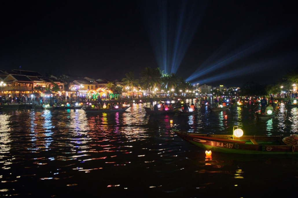 Lantern-lit boats on the river at Hoi An after dark.