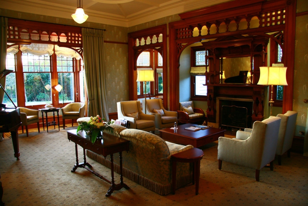The drawing room at Otahuna Lodge, with its carved fretwork and garden windows.