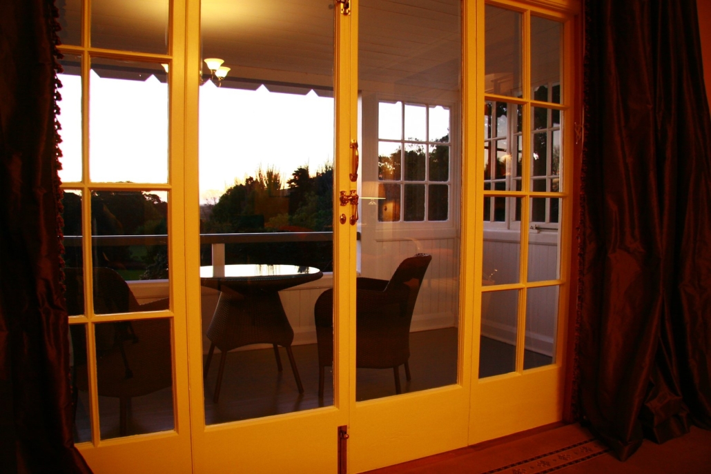 Doors opening onto the terrace at Otahuna Lodge.