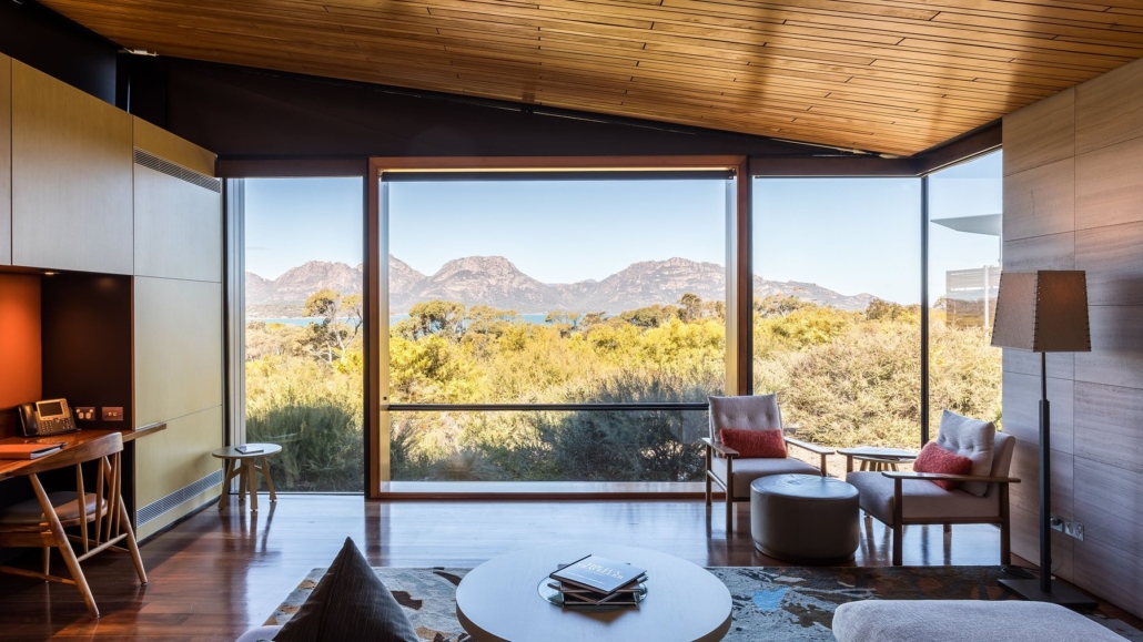 The lounge of a Signature Suite, with floor-to-ceiling glass framing the peaks.
